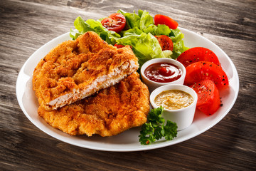 Fried pork chops and vegetable salad 