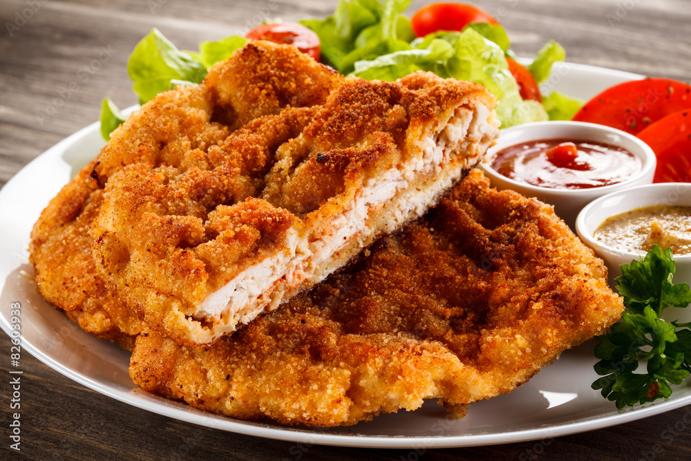 Sticker fried pork chops and vegetable salad