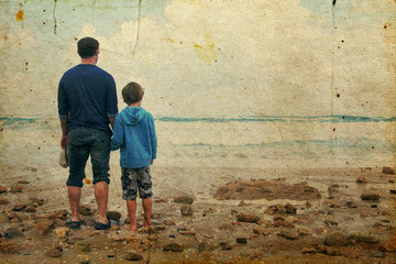 Fototapeta na wymiar father and son walking on the beach