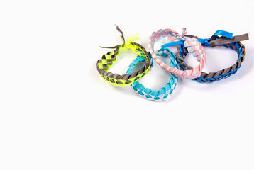 Fashionable youth bracelets braids on a white background