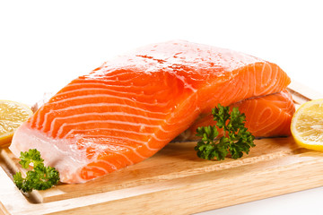 Fresh raw salmon fillet on cutting board 