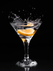 Vermouth cocktail inside martini glass over dark background