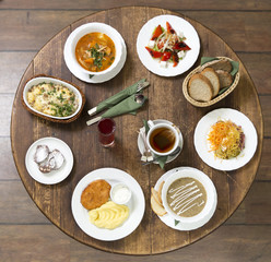 Business lunch on a vintage round table.Tuesday