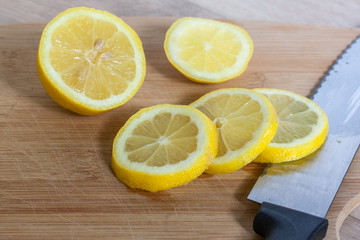 Fototapeta na wymiar Sliced Lemons on a Cutting Board