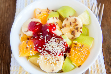 Fruit salad with cranberry sauce, sesame seeds
