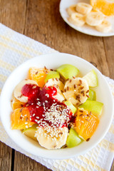 Fruit salad with cranberry sauce, sesame seeds