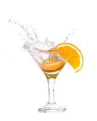 cocktail in a martini glass on a white background with fruit