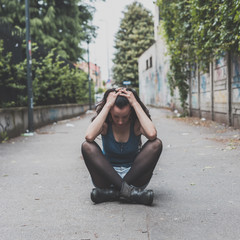 Fototapeta premium Beautiful girl posing in the city streets