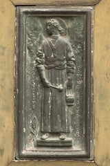 Ancient bronze sculpture of a doorway