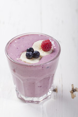 Smoothies of frozen raspberries, blueberries and banana with yog