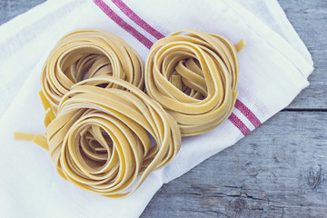 Fresh Homemade Pasta on the wooden table. Tonned photo.