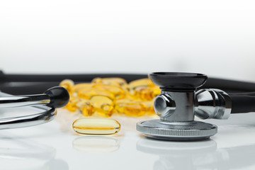 Omega 3 capsules with stethoscope