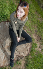 Pretty young girl walks in forest