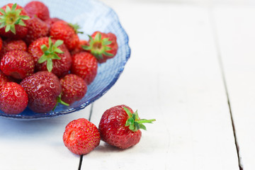 strawberries overwhite wood