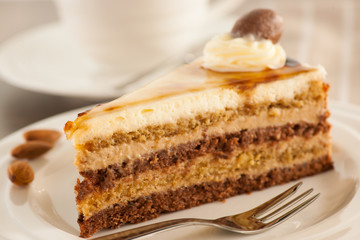 Deliceous slice og Caramel Mousse cake on a plate  for breakfast