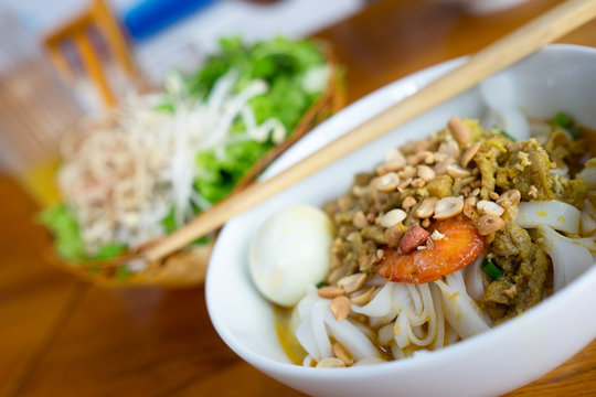A bowl of Noodle with Pork, Shrimp, vegetables, and Egg (My Tom