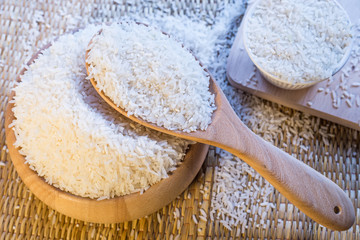 a bowl of rice on wooden surface top view