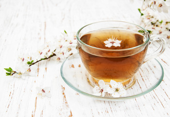 Cup of tea and spring blossom