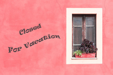 Closed window with planter - Closed for vacation