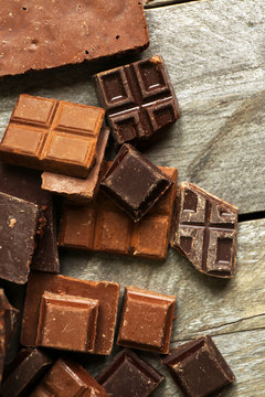 Set of chocolate on wooden table, closeup