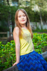 Fototapeta premium Summer portrait of a pretty little girl