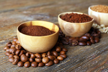 Various of coffee in small dishes on wooden background
