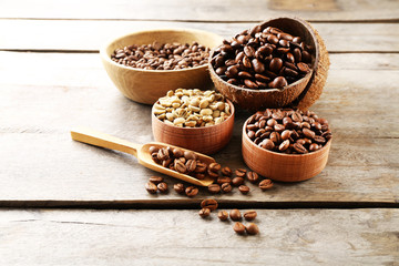 Various of coffee in small dishes on wooden background