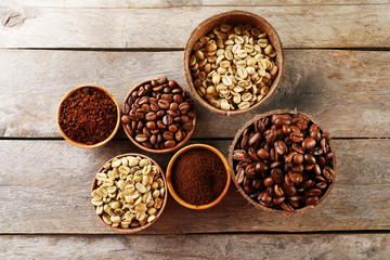 Various of coffee in small dishes on wooden table, top view