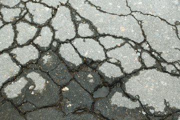 Fototapeta premium Cracked asphalt close up