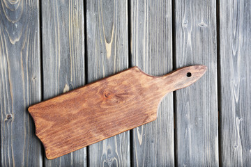 Cutting board on wooden background