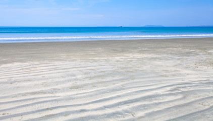 Fototapeta na wymiar Beautiful and clean sand beach with nice blue sea and sky