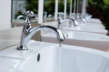 Water drop from chrome faucet