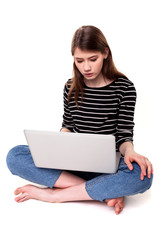 Young Thinking Woman with PC on Floor E-commerce Stock Image