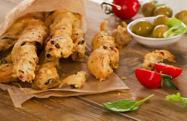 Homemade BreadSticks on  old rustic wooden board.