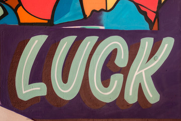 word luck painted on the wall