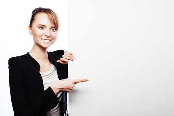  young business woman showing blank signboard