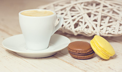 A cup of coffee "espresso" and  macaroon.