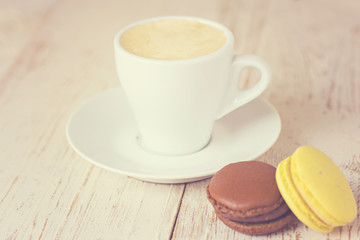 A cup of coffee "espresso" and  macaroon. toned photo