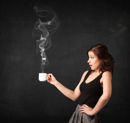 Businesswoman holding a white steamy cup