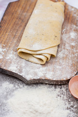 Homemade spaghetti, pasta or noodles on wooden table. 