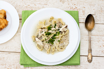Homemade spaghetti, pasta or noodles on wooden table. 
