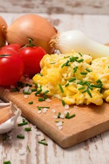 Vertical photo of scrambled eggs mixed with chive