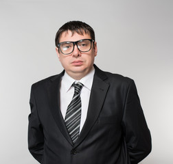 Portrait of a young businessman, with glasses