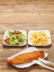 Fried fish and chips on a paper tray