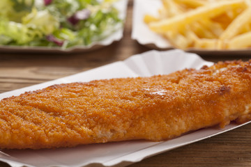 Fried fish and chips on a paper tray