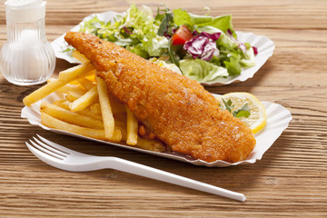 Fried fish and chips on a paper tray