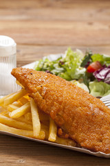 Fried fish and chips on a paper tray