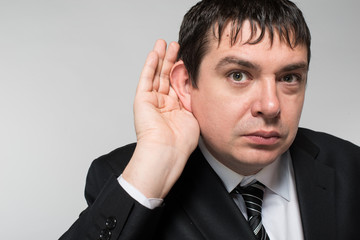 businessman eavesdropping secrets