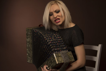 Beautiful woman singing with accordion