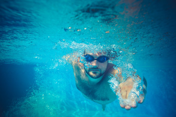 Underwater portrait of young man